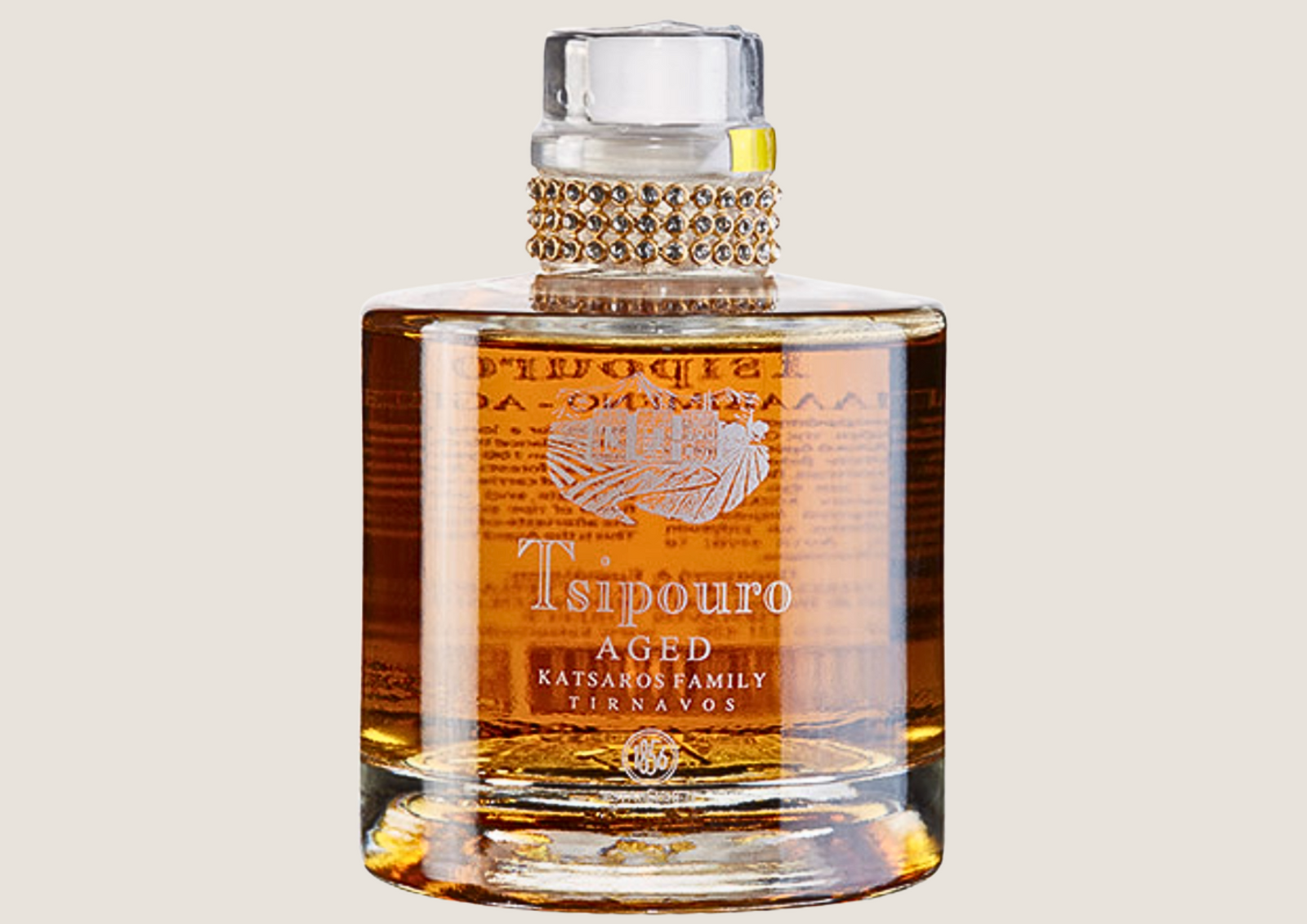 Edler bernsteinfarbener Tsipouro in eleganter Glasflasche mit verziertem Verschluss.